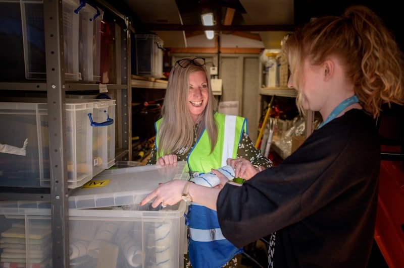 Two colleagues reviewing shipment paperwork