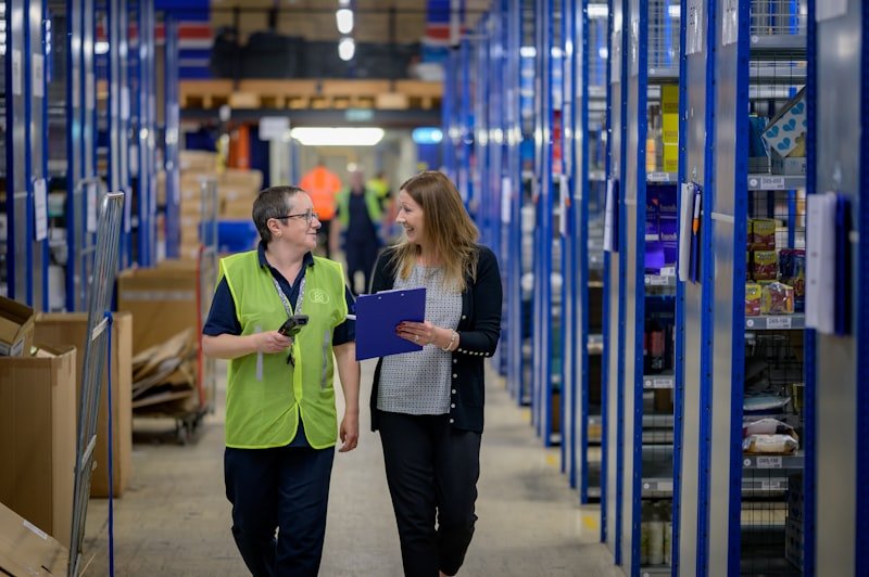 Warehouse coordinators reviewing a shipment